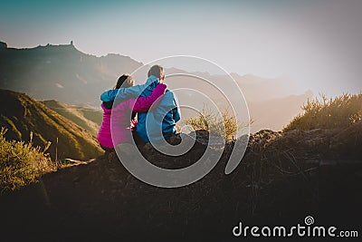 Happy loving couple hiking in mountains, family travel in nature Stock Photo