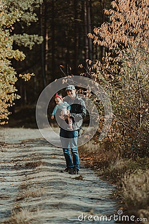 Happy loving family. Father and his daughter child girl playing and hugging outdoors. Cute little girl hugs daddy. Concept of Stock Photo