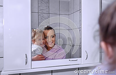 Happy loving family. Mother and her daughter child girl kissing Stock Photo