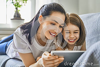 Mom and child with tablet Stock Photo