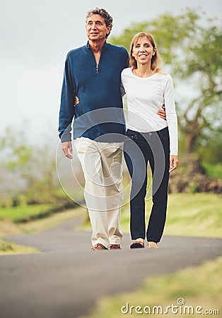 Happy loving middle aged couple walking Stock Photo