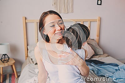happy loving mother hugs with child son in the morning in bed. Stock Photo