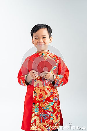 Happy lunar new year. little boy showing red envelope Stock Photo