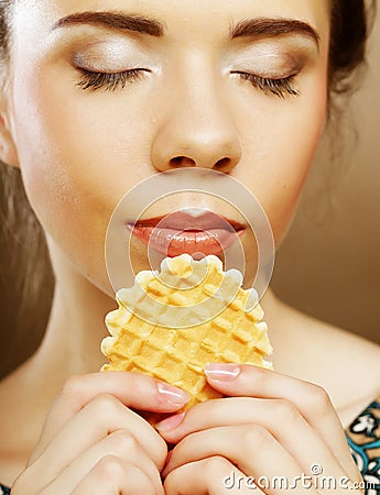 Happy lwoman with cake wafer Stock Photo