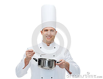 Happy male chef cook with pot and spoon Stock Photo