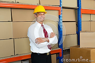 Happy Male Manager With Arms Crossed Stock Photo