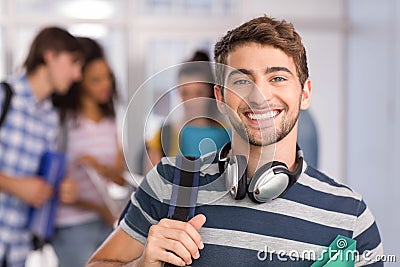 Happy male student in college Stock Photo