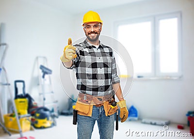 Happy male worker or builder showing thumbs up Stock Photo