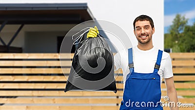 happy male worker or cleaner showing garbage bag Stock Photo
