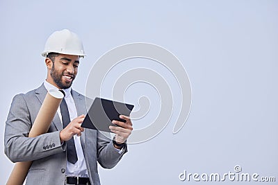 Happy man, architect and tablet on mockup in construction planning on a studio background. Person, engineer or Stock Photo