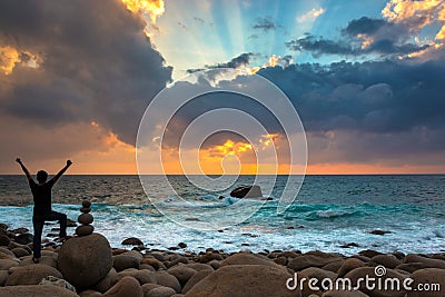 Happy Man Praising or Worshiping at Amazing Sunrise Stock Photo