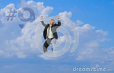 Happy man elated smiling with arms up floating on cloud nine Stock Photo