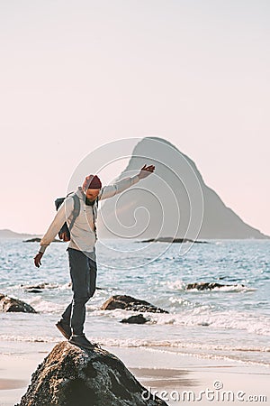 Happy man enjoying ocean beach traveling active lifestyle Stock Photo