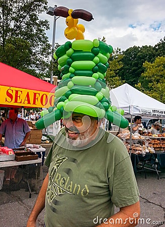 Happy Man at Farmer's Market Community Event Editorial Stock Photo