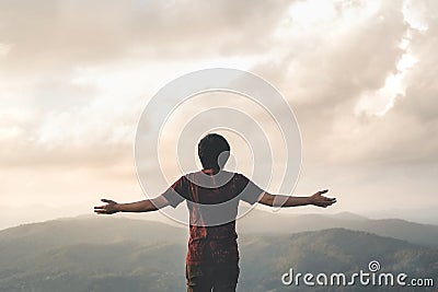 Happy Man Freedom in sunrise nature Successful concept Stock Photo