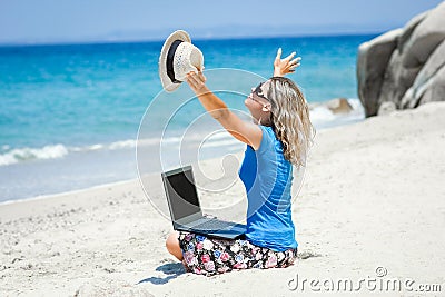 A Happy man girl with laptop near the seaside weekend travel Stock Photo