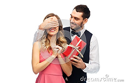 Happy man giving woman surprise present Stock Photo