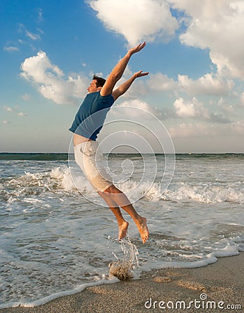 Happy man jump near sea Stock Photo