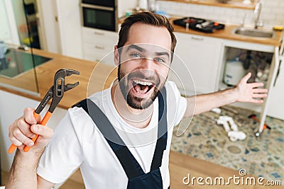 Happy man plumber work in uniform Stock Photo