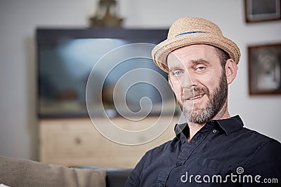 Happy man portrait at home in front of aquarium Stock Photo