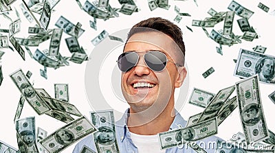 Happy man in sunglasses with falling dollar money Stock Photo