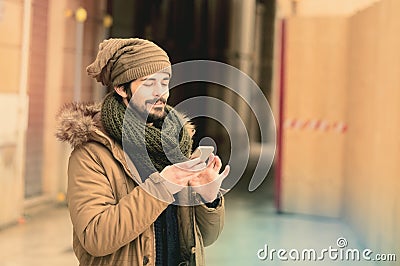 Happy man talking on the phone instagram tones applied Stock Photo