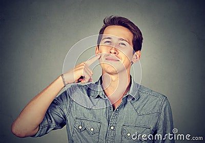 Happy man with it tastes good sign Stock Photo