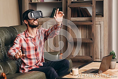 Happy man in vr glasses playing video game Stock Photo