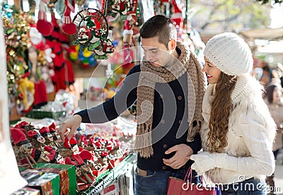 Happy married couple at Catalan Christmas market Stock Photo