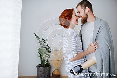 Happy married couple in love at home, standing close, feeling each other Stock Photo