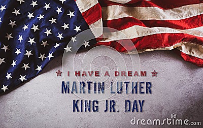 Happy Martin Luther King Day concept. American flag againt dark stone background Stock Photo