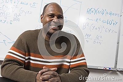 Happy Math Professor In Classroom Stock Photo