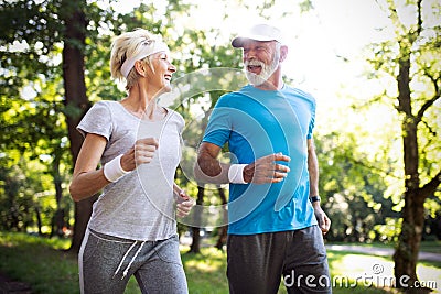 Happy mature people couple exercising for healthy life Stock Photo