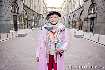 Happy mature woman traveling in town with enjoyment Stock Photo