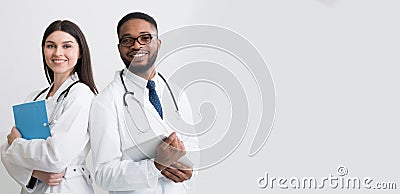 Happy Medic Workers. Portrait Of Two Doctors In White Coats Stock Photo