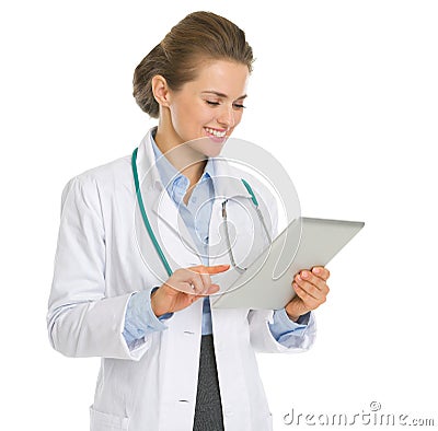 Happy medical doctor woman using tablet PC Stock Photo