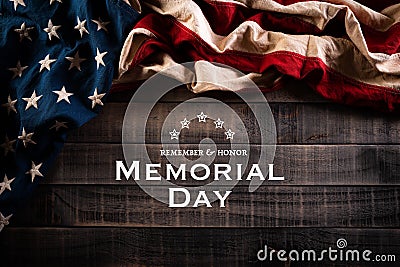 Happy Memorial Day. American flags with the text REMEMBER & HONOR against a old wooden background. May 25 Stock Photo