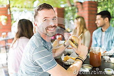 Happy To Have Mouthwatering Burger Stock Photo