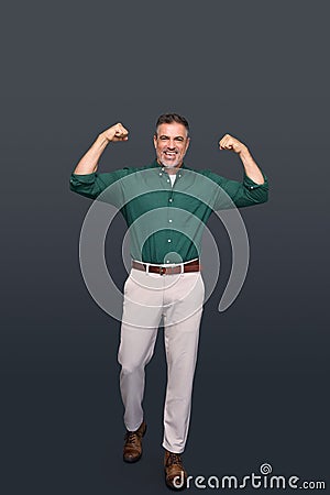 Happy middle aged business man winner raising arms celebrating success. Stock Photo