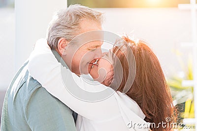 Kissing Middle Aged Couple Enjoy A Romantic Slow Dance Outside Stock Photo