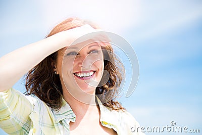 Happy midle aged woman protecting from sun Stock Photo