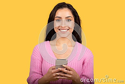 Happy millennial caucasian woman with smartphone chatting in social media Stock Photo