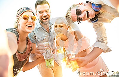 Happy millennial friends group taking selfie at fun beach party Stock Photo