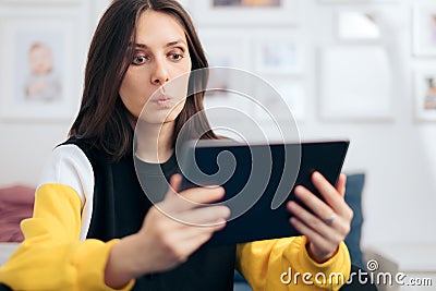 Cheerful Woman Holding PC Tablet at Home Stock Photo