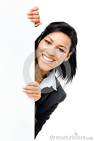 Happy mixed race business woman pointing at empty copy space iso Stock Photo