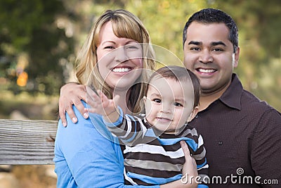 Happy Mixed Race Ethnic Family Outdoors Stock Photo