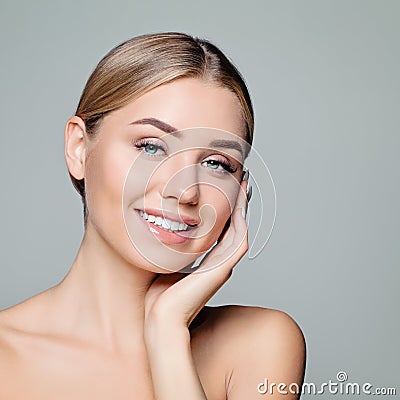 Happy model girl face. Pretty woman with clear skin. Facial treatment, skin care and cosmetology concept Stock Photo