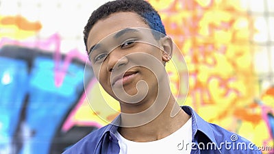 Happy modern college student smiling on camera, urban subculture, teen spirit Stock Photo