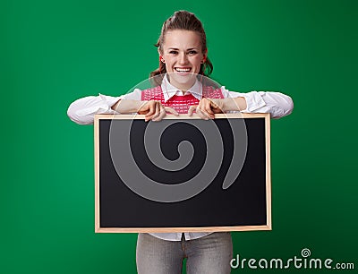 Happy modern student woman in headphones showing blackboard Stock Photo