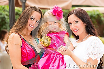 Happy mom and child girl hugging. The concept of childhood and family. Beautiful Mother and her baby outdoor Stock Photo